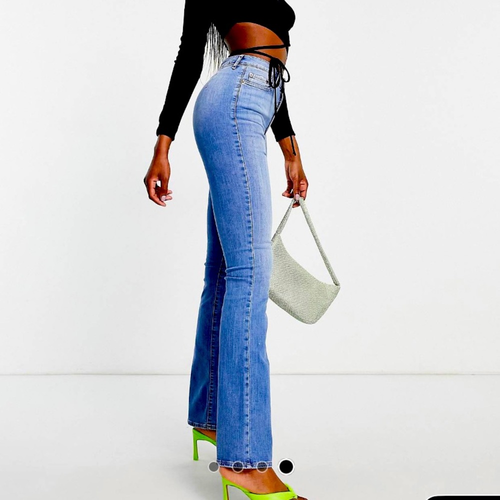 ASOS Design Tall High Rise “Y2K” stretch flair jeans in Midwash W30 L36
